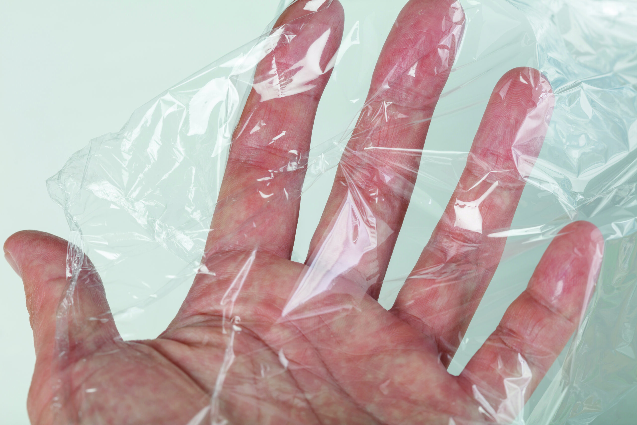wrapping plastic transparent food film on white background.